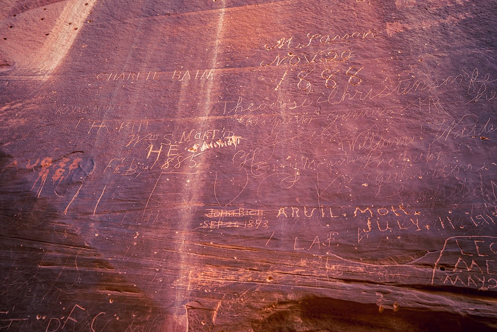 The Pioneer Register in Capitol Gorge, where early travelers carved their names into the canyon walls in the 1800s. © Roaming the Southwest