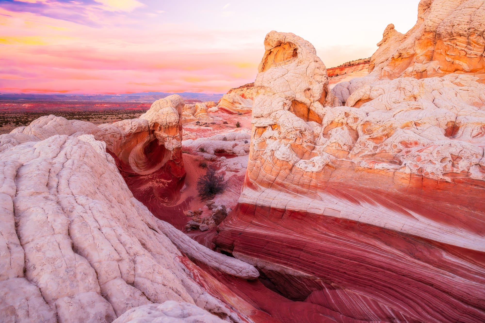 Sunset over the colorful sandstone formations at White Pocket, Arizona