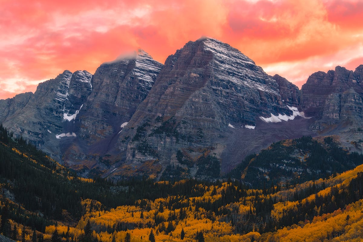 Fiery sunset over the Maroon Bells with fall colors