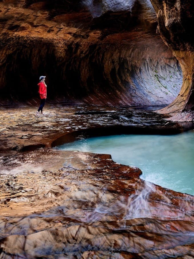 Hiker in the Subway known as Left Fork of North Creek in Zion National Park, Utah