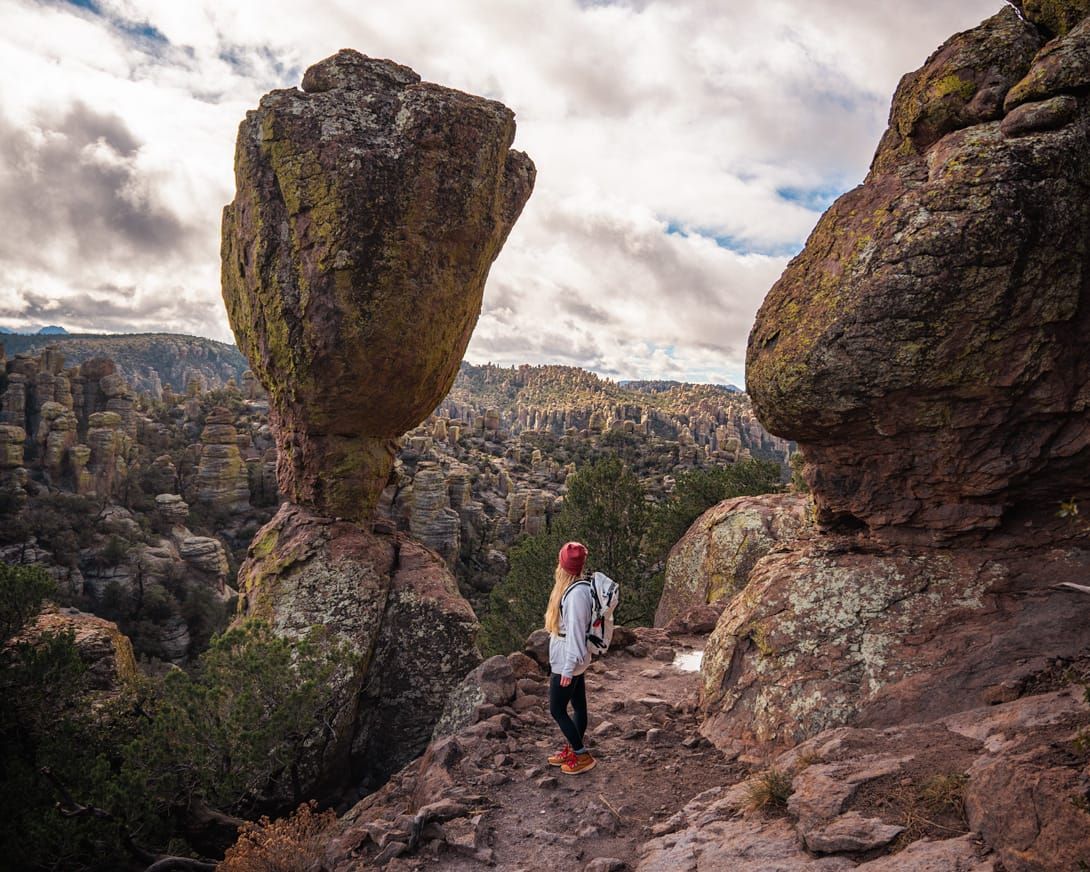 Standing beside Tulip Rock along the Echo Canyon Trail near the Grottoes in Chiricahua National Park, Arizona.