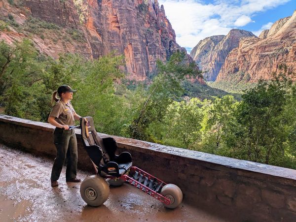 All-terrain wheelchair being used on the steep, paved Weeping Rock Trail in Zion National Park, Utah.