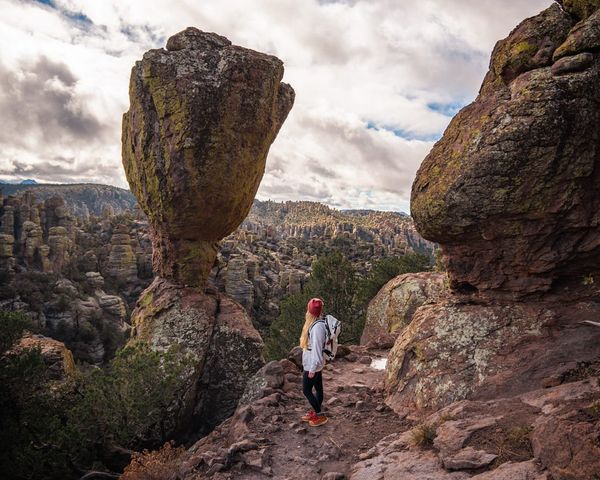 Standing beside Tulip Rock along the Echo Canyon Trail near the Grottoes in Chiricahua National Park, Arizona.