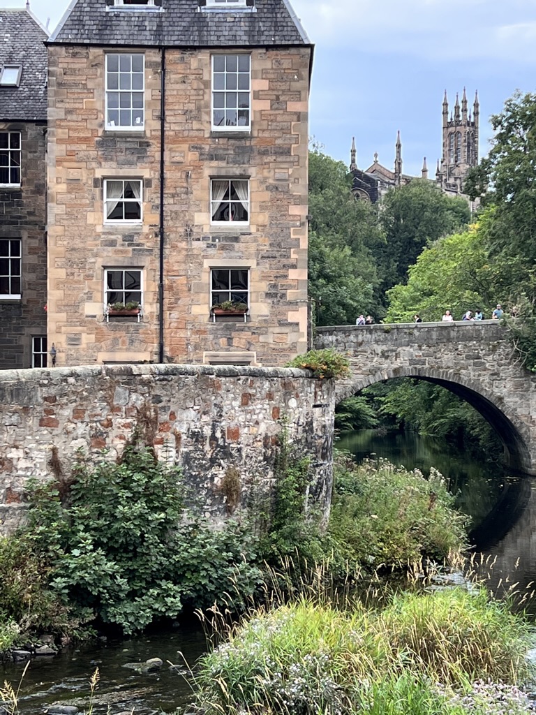 Dean Village bridge over Waters of Leith with cathedral in background