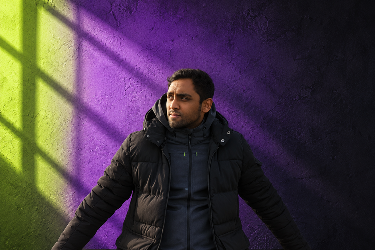 AI-assisted editorial portrait of Sures in natural colour against a violet, black and lime-green background.