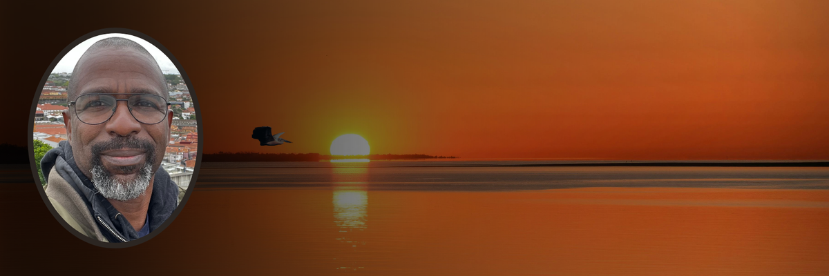 Sunset on the Caribbean Sea with a pelican flying over the water. Inset photo of Elliott D. Page.