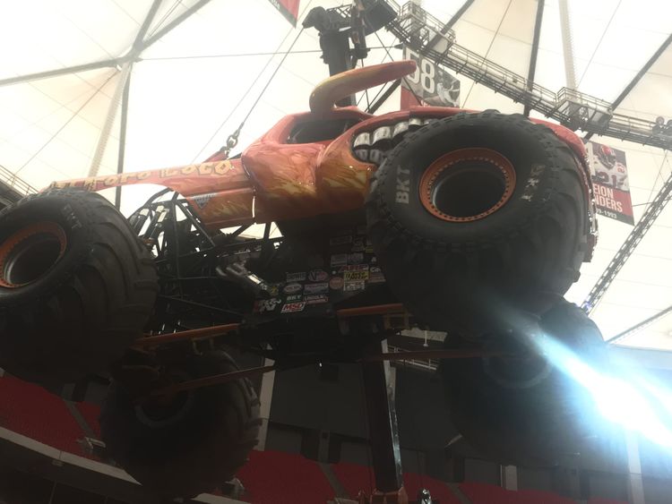 Monster truck on a crane.