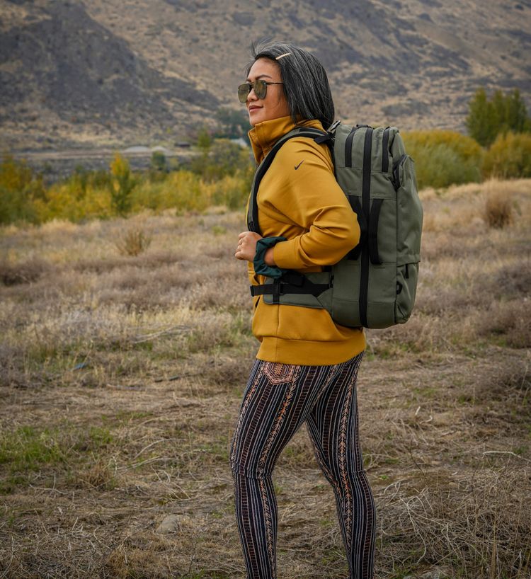 Savvy traveler with her traveling backpack - all she needs and low cost travel.