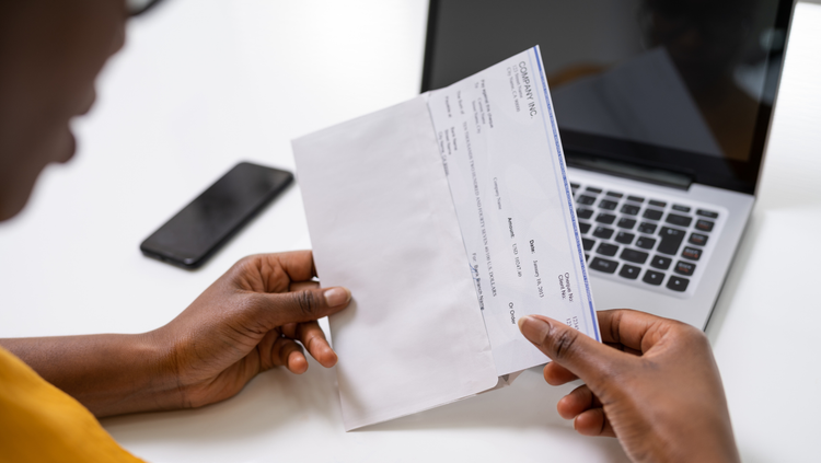 Person looking at paycheck