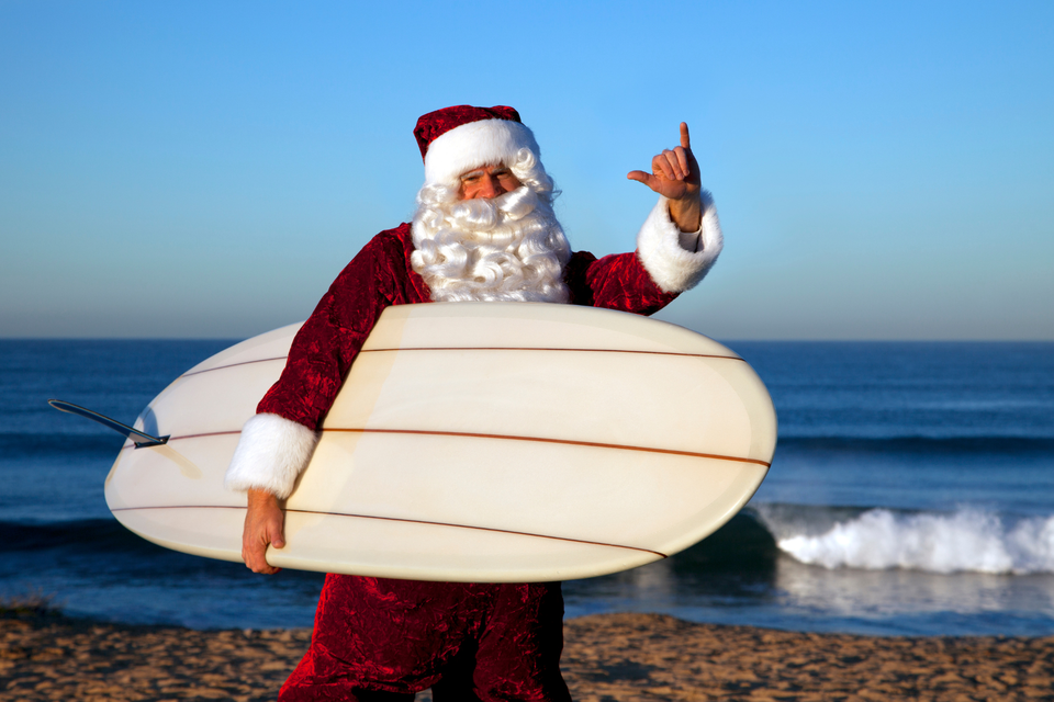 Santa Clause going surfing.