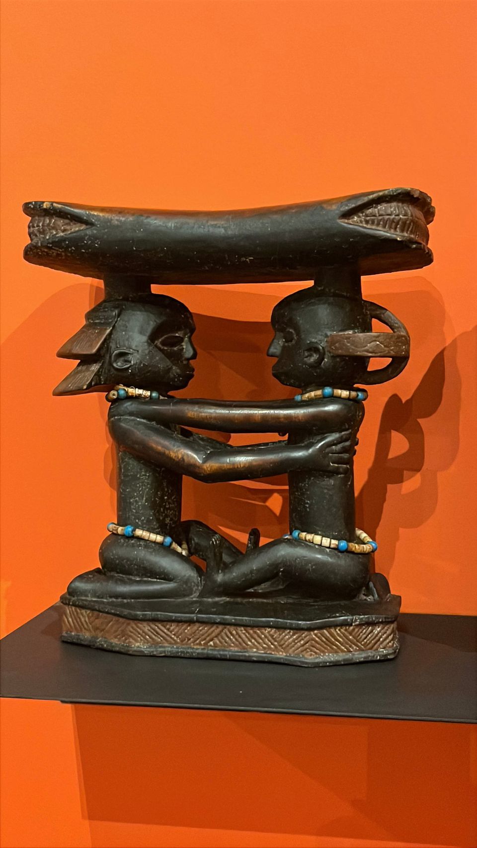 Statues stoll of a man and woman.