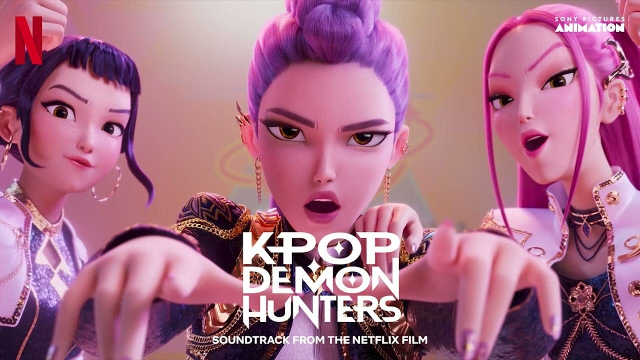 A banner with the three characters from K Pop Demon Hunters, from left to right: Zoey, Rumi, and Mira