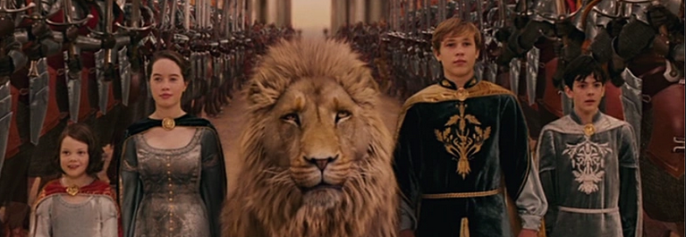 The 4 Pevensies divided by Aslan walking toward their coronation 
