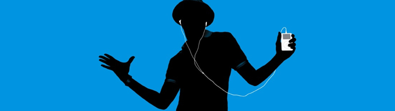 A black figure dances atop a blue background, with a white iPod in his hands. This is a classid iPod advert.