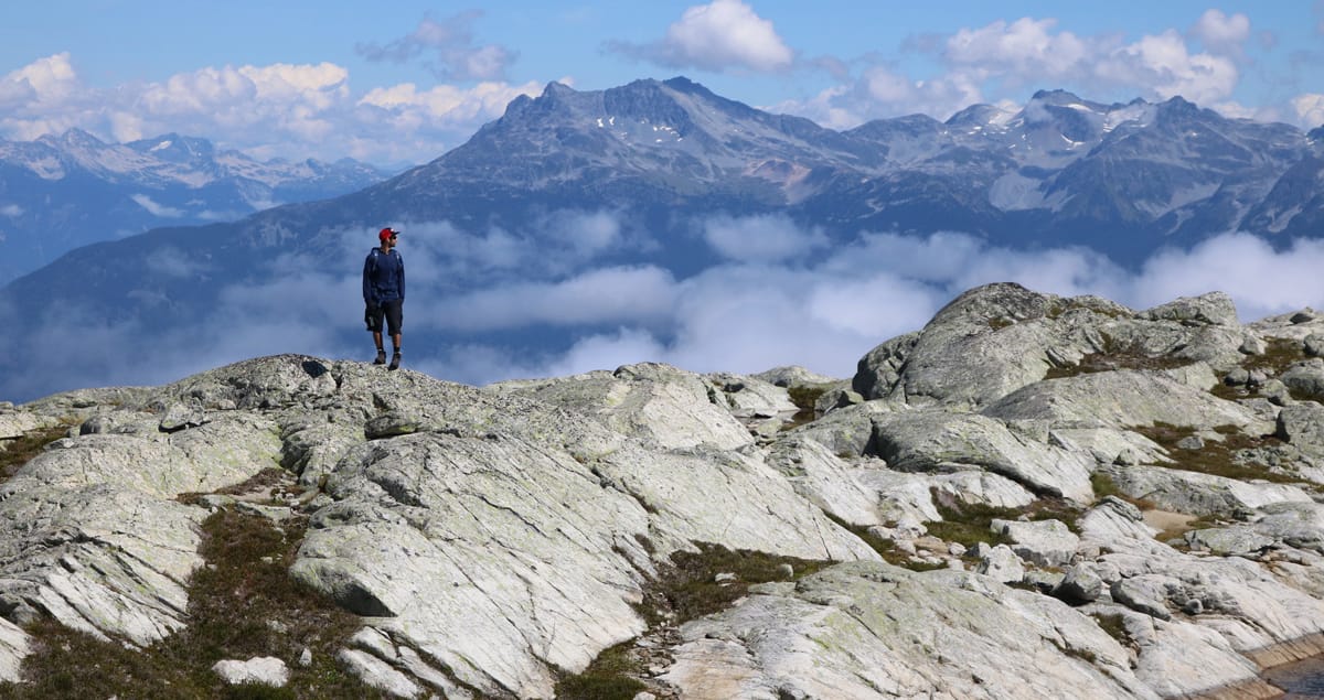 A hiker stands atop the Skywalk Trail in Whistler