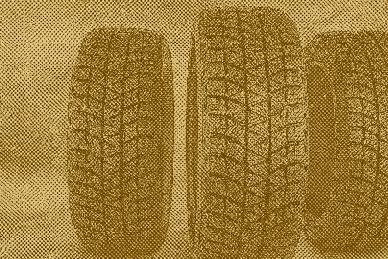 Close-up of winter tires showing tread patterns and sipes