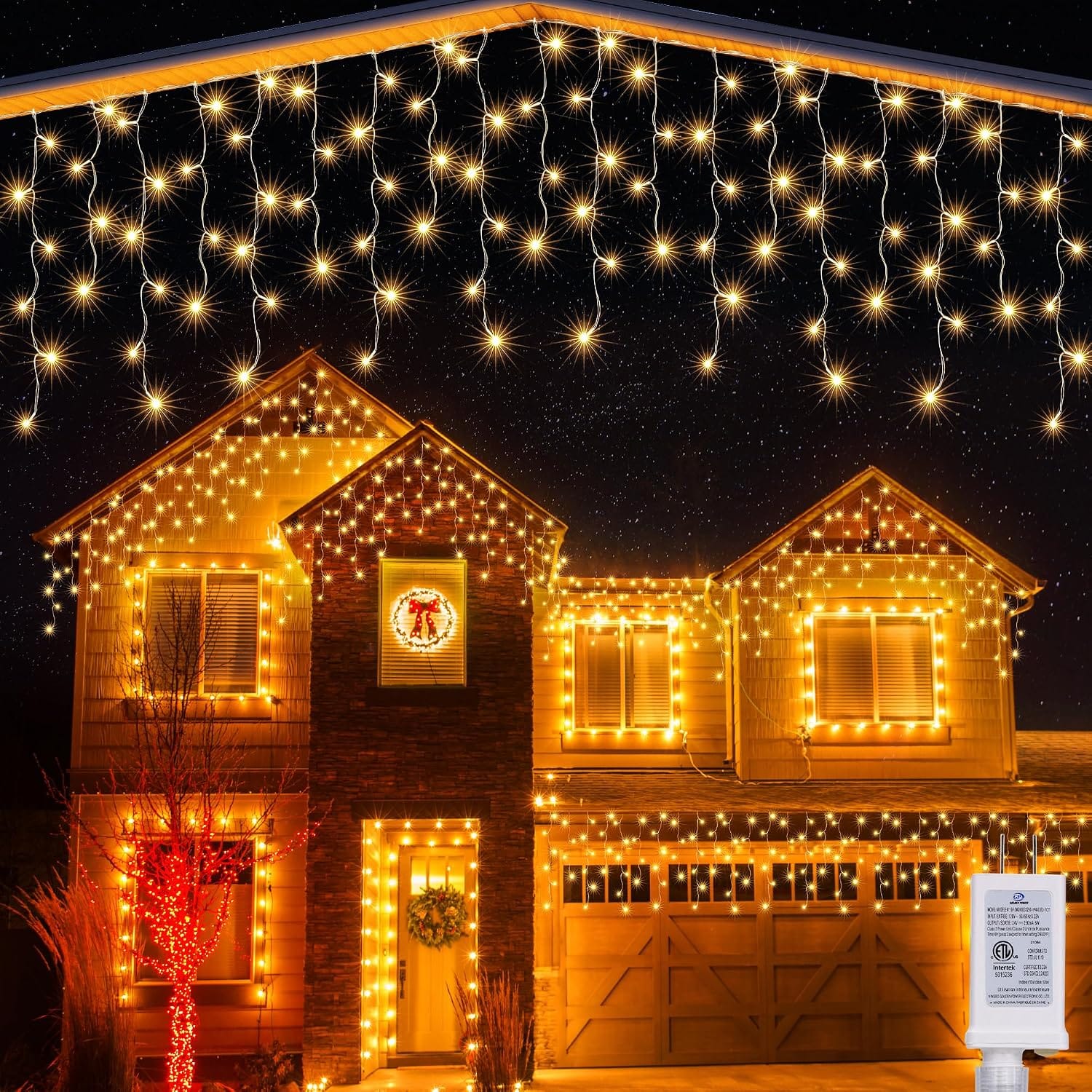 Two-storey house with warm white Joomer icicle lights hanging along the roofline