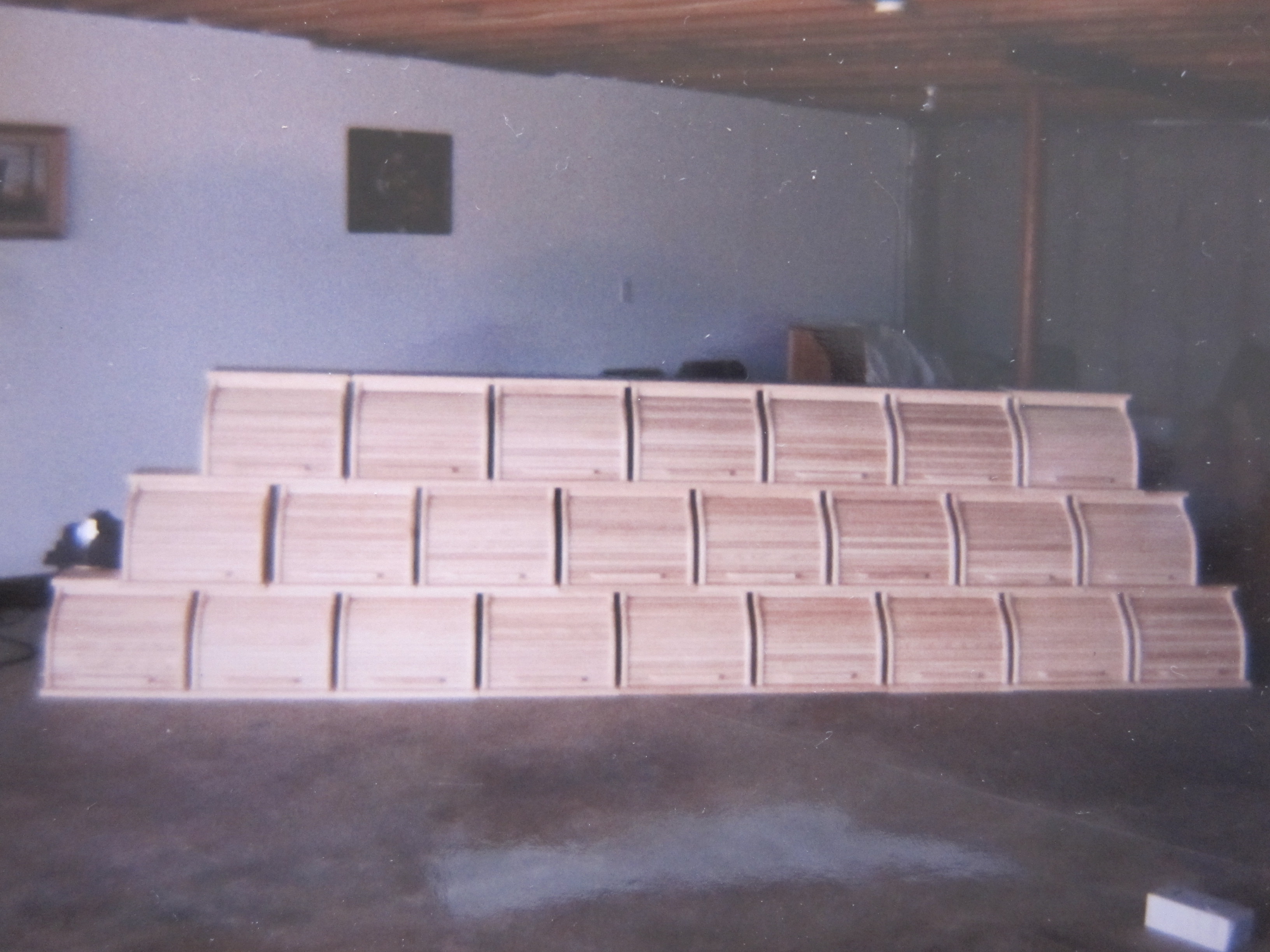 24 bread boxes lined up in three rows.