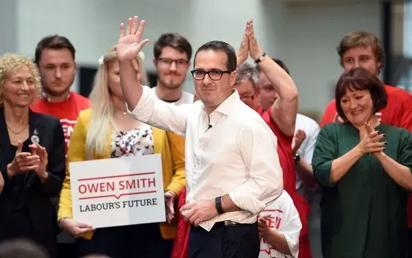 Owen Smith waving.