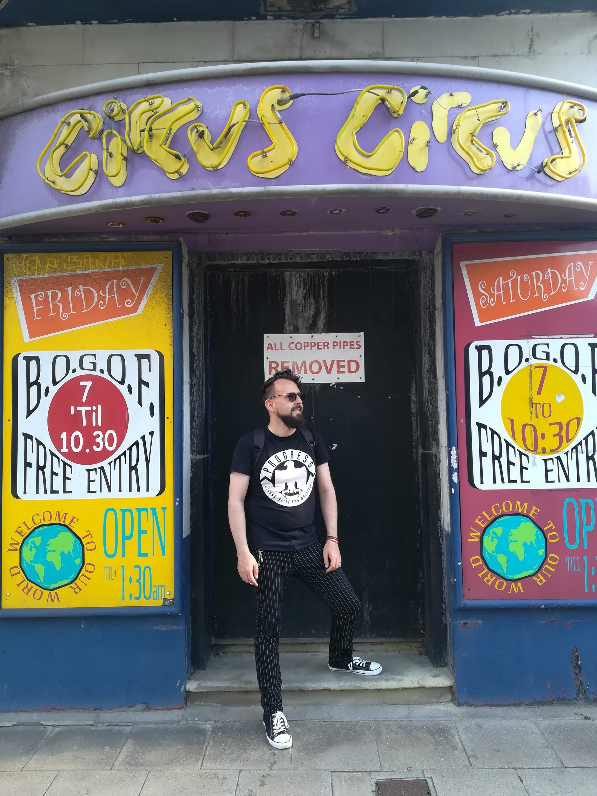 Me, a white person with dark hair and beard, in the old doorway of Circus Circus in Hull.