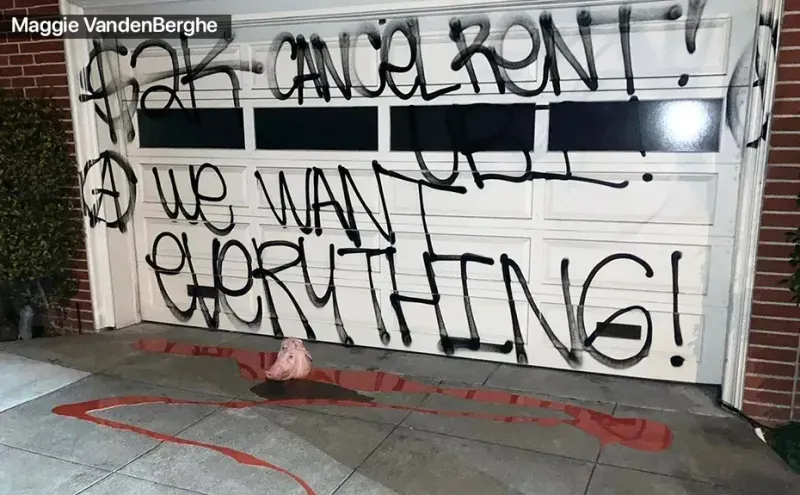 Nancy Pelosi's garage door sprayed with graffiti stating "Cancel rent! We want everything!" with a pig's head on the floor in a pool of blood.