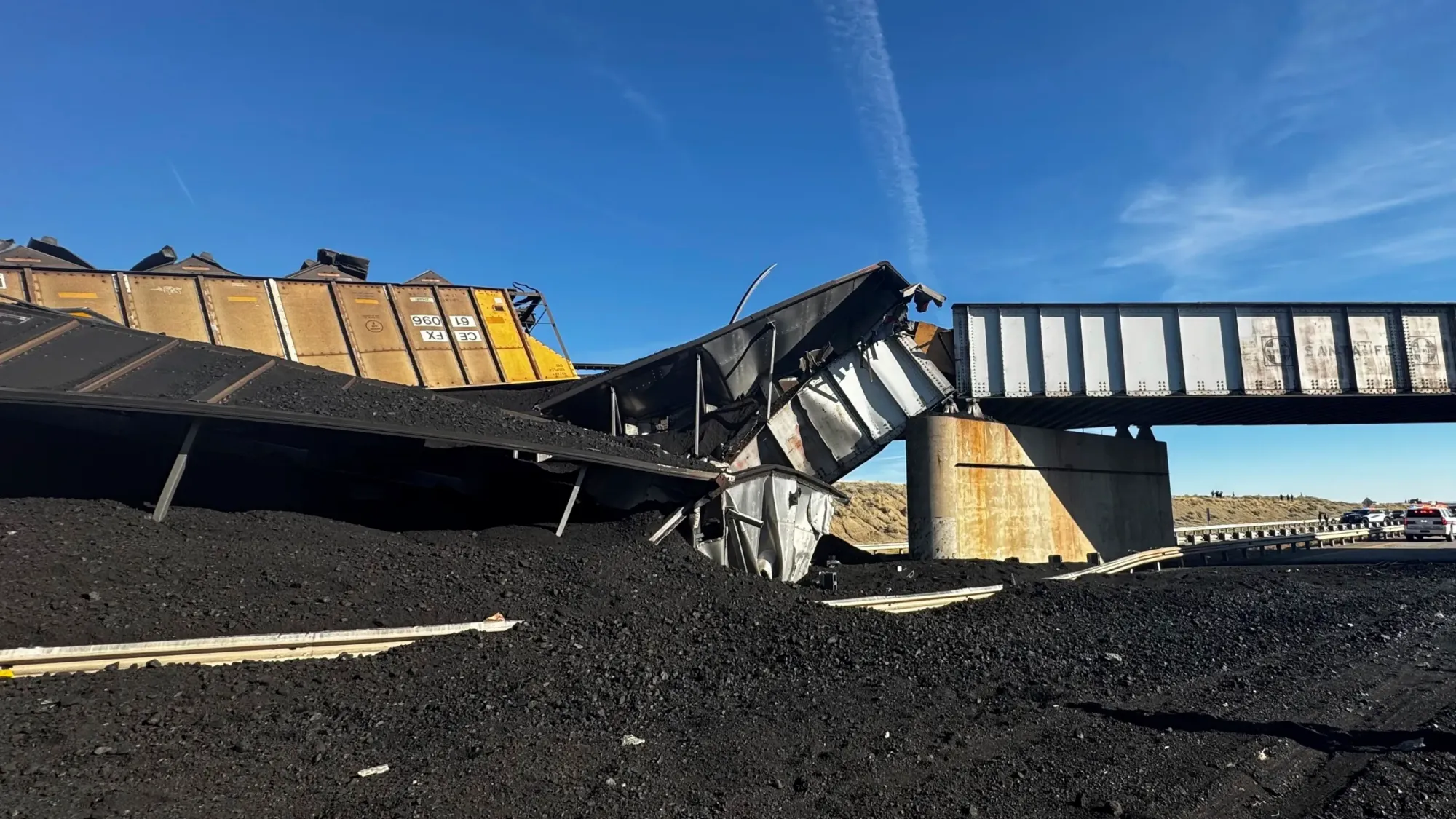 by: Associated Press - Colorado train derails, spilling train cars and coal onto a highway and trapping a semi-truck driver