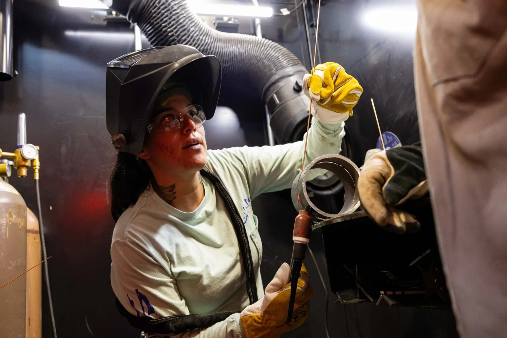 Palo Alto College welding technology student Sandra Gomez works with students one-on-one in the welding lab on Sept. 25, 2025.
