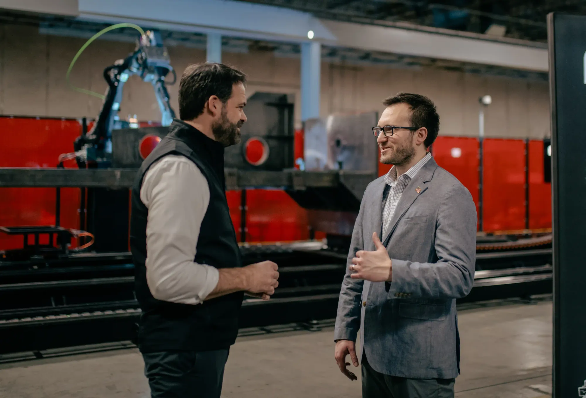 Eric Chewning (Left), HII’s executive vice president of maritime systems & corporate strategy, and Andy Lonsberry (right), CEO and co-founder, Path Robotics signed a memorandum. Credt: HII