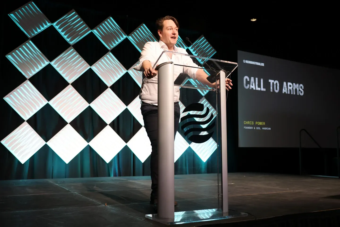 Chris Power, founder and CEO of Hadrian, speaks onstage during the Reindustrialize Conference 2025.