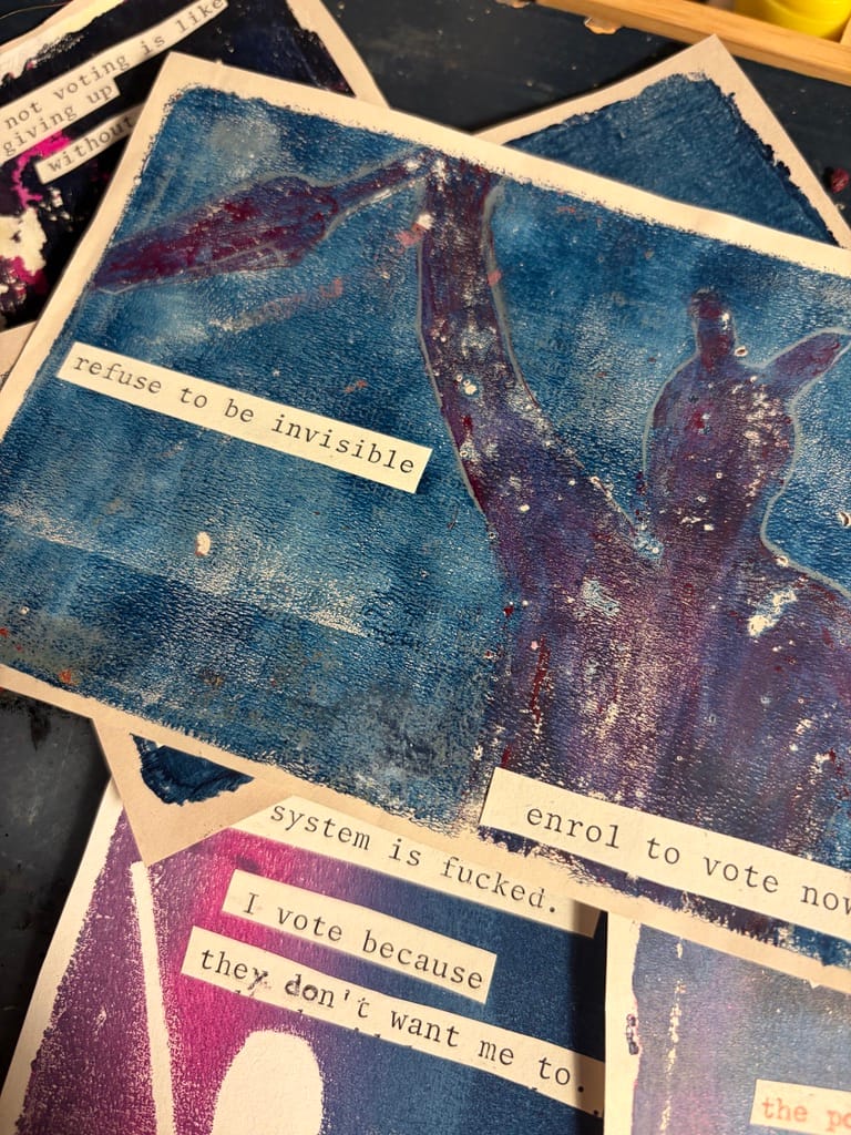 Blue gelli-prints with rangatira with raised fist, and quote 'refuse to be invisible'