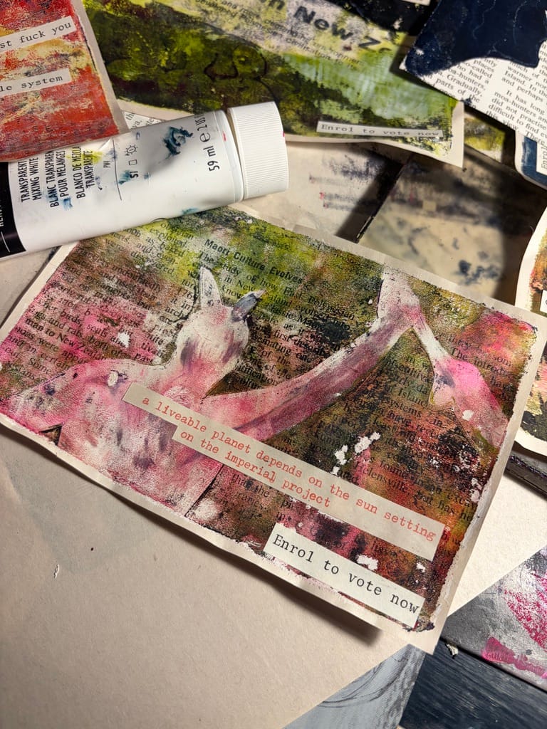 Pink and Green Gelliprint with a rangatira with a raised fist and typewritten text: a livable planet depends on the sun setting on the imperial project"