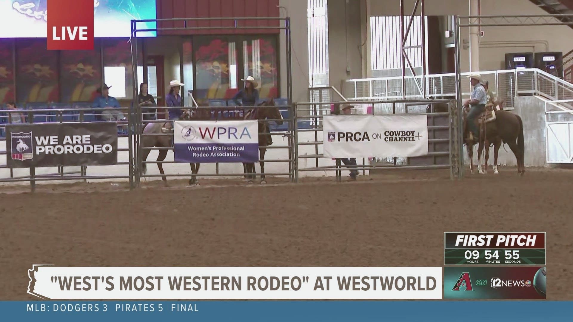 of a dusty rodeo arena at dusk, empty wooden bleachers curving around a dirt floor, warm amber light from overhead fixtures