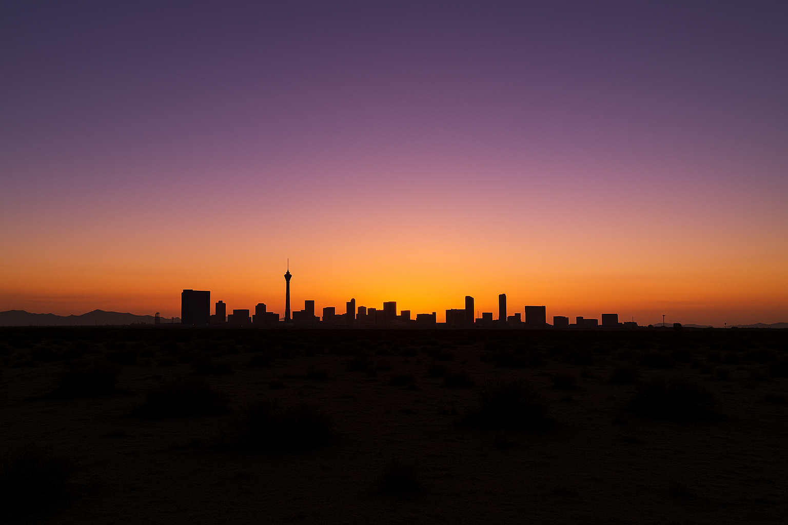 Wide desert sky at dusk over a flat urban horizon, warm orange and purple gradient, no people, no text