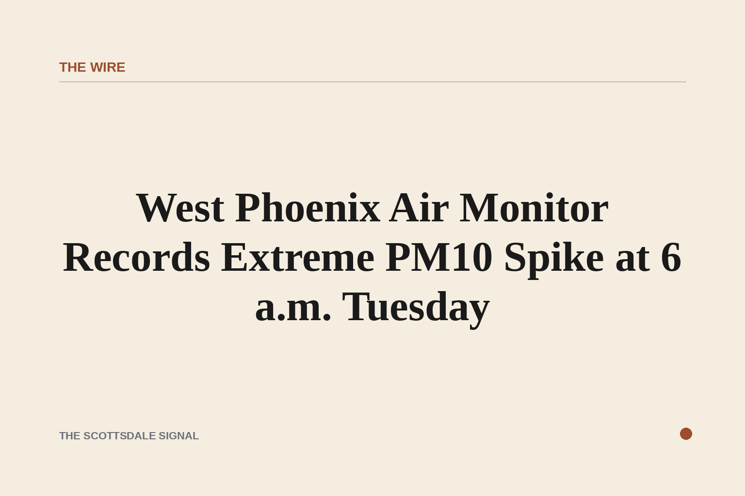Wide aerial view of a hazy desert valley at dawn, brown particulate haze obscuring a flat urban grid, pale orange sky, no peo