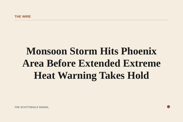 of a dark monsoon sky over a desert valley at dawn, heavy clouds lit from within by distant lightning, no people