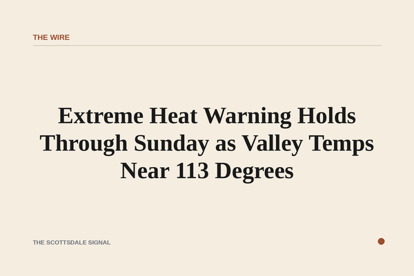 of a sun-baked desert wash at midday, heat shimmer rising from cracked earth, McDowell Mountains in the distance under a pale