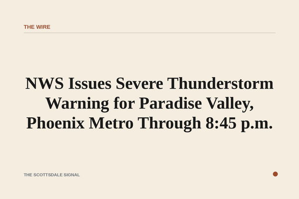 of a dark monsoon sky over a desert valley at dusk, heavy clouds lit from below by city lights, no people