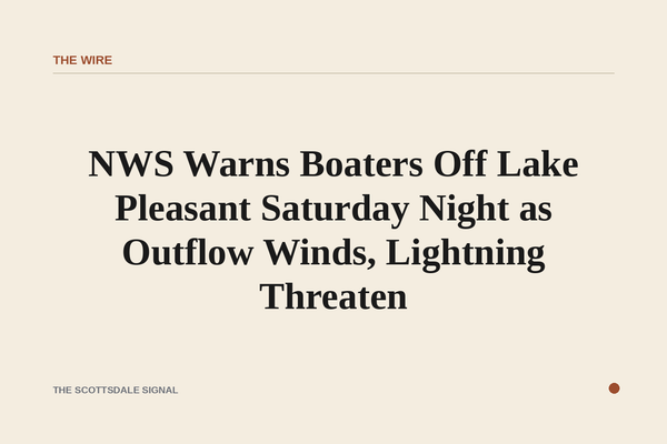 of a desert lake at dusk with dark storm clouds building on the horizon, no people, no boats visible, warm orange light fadin