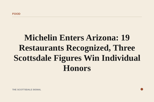of a red hardcover guidebook resting on a linen-draped restaurant table at dusk, desert landscape visible through a window be