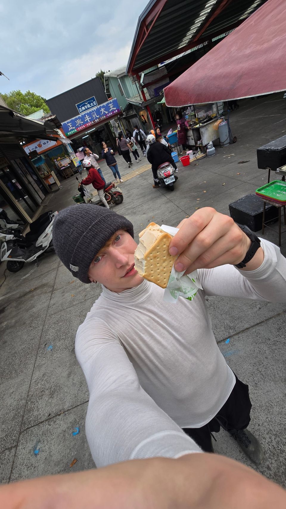 Eating a Zheng Dian Milk King cookie ice cream sandwich — so good.