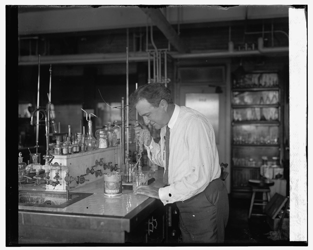A man tests sauerkraut. 