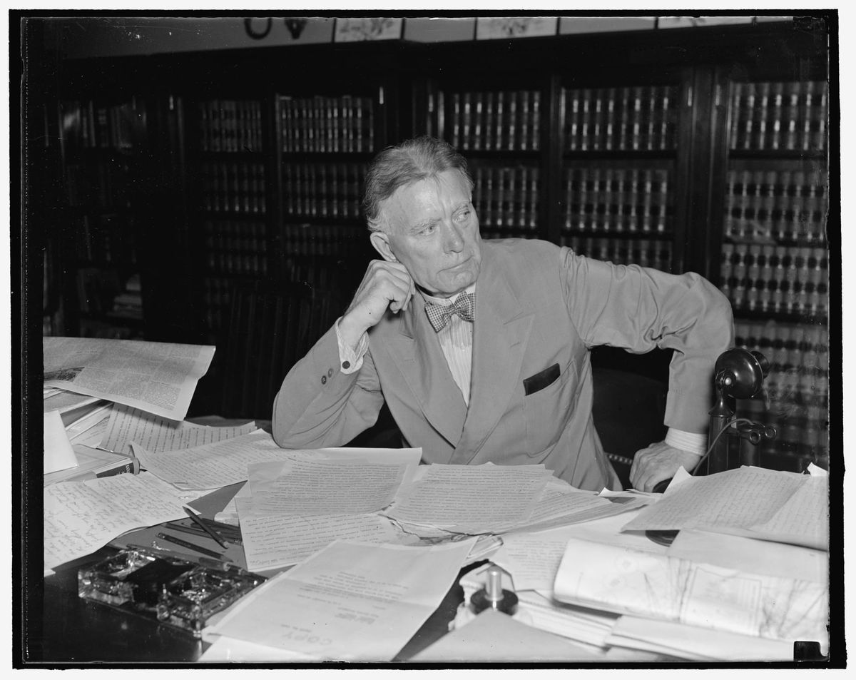 Senator Borah reading mail 