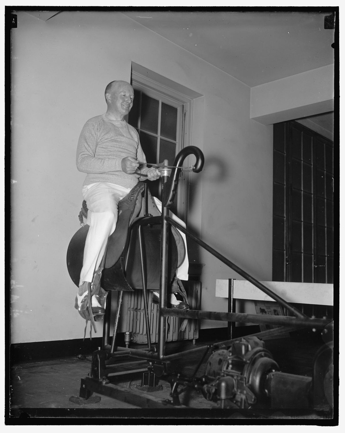 Congressman Clason sits on an electric horse at the U.S. House gym. 