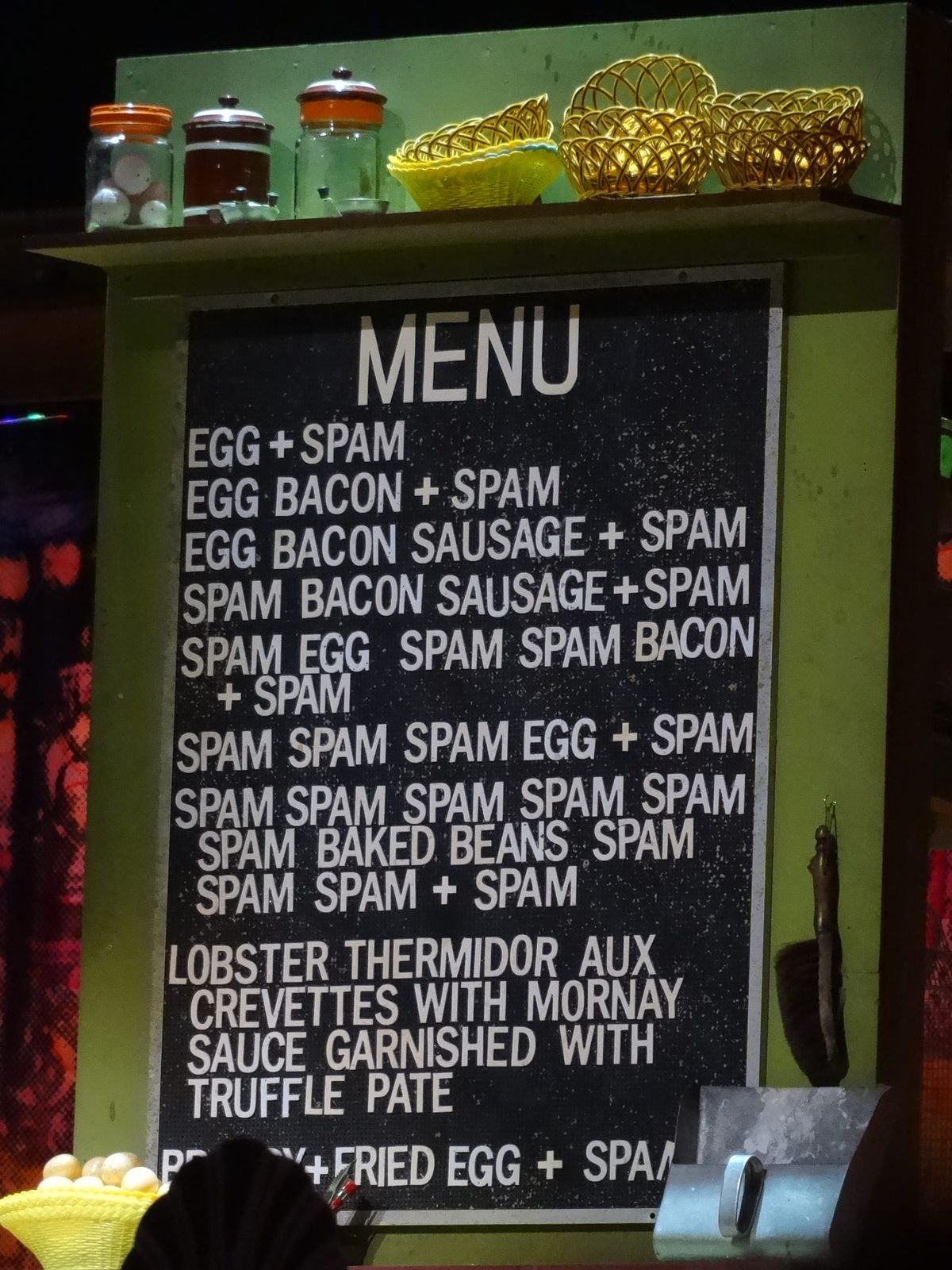 A menu board with breakfast options, all of which have spam in them. 