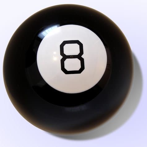 A black Magic 8 ball on a white background. 