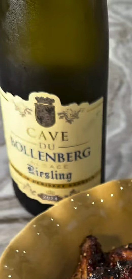 Bottle of Cave du Bollenberg Alsace Riesling 2024, front label, beside the yellow bowl of glazed wings