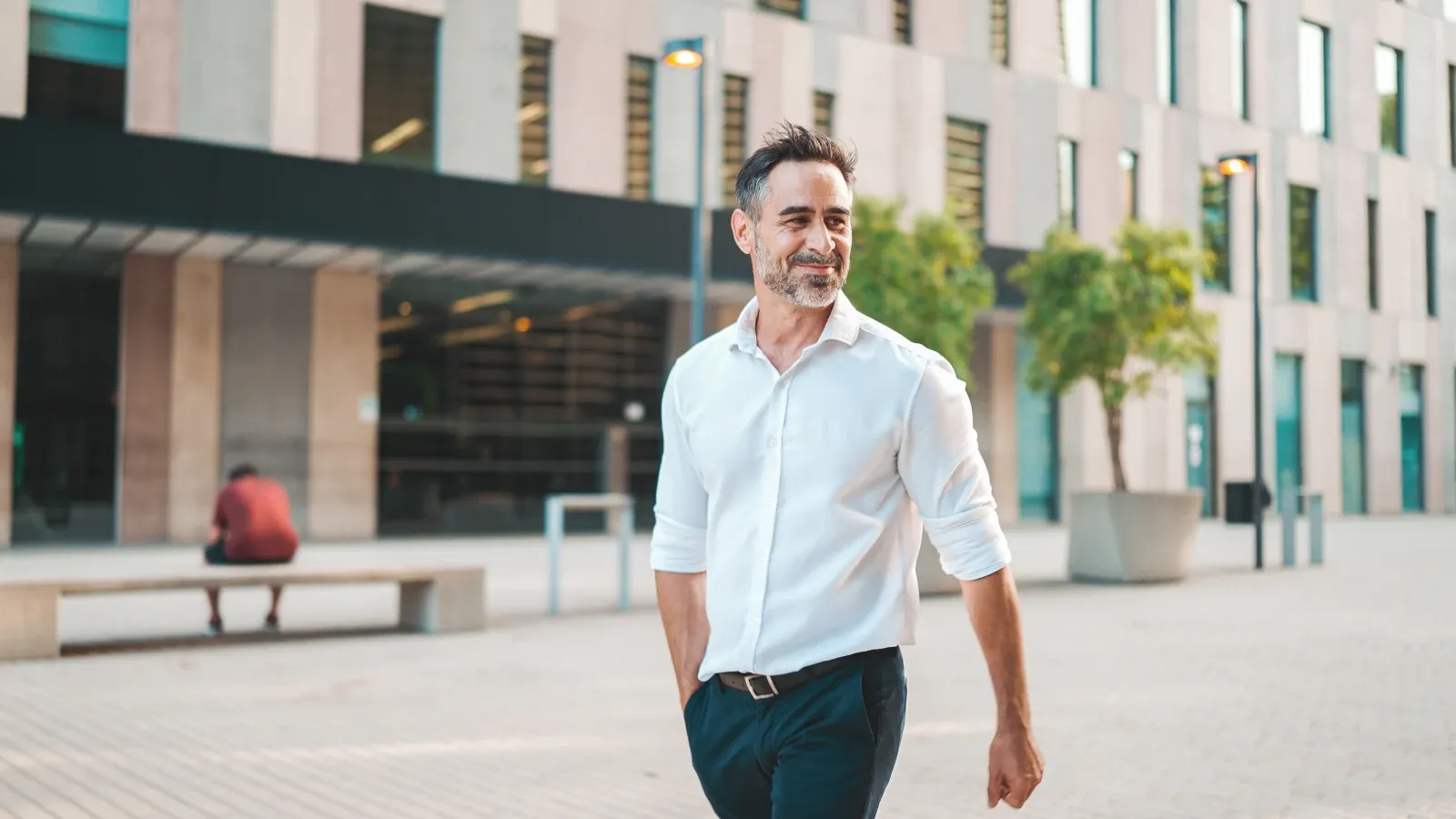 Employee taking a walk outside the workplace to clear his mind and support his wellbeing.