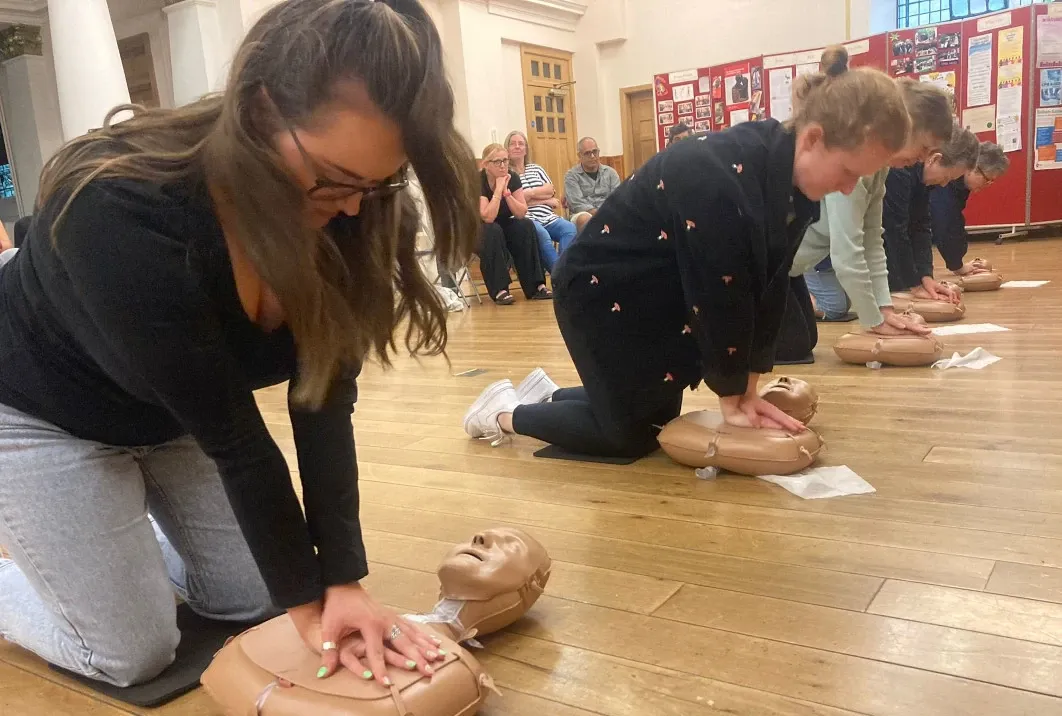 A group learning CPR