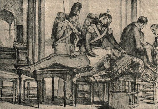 19th-century engraving showing military surgeons treating a wounded officer during the Napoleonic era