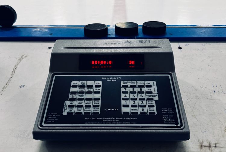 A photo of a hockey rink scoreboard control unit